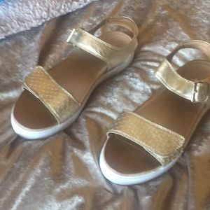 Gold sandals.